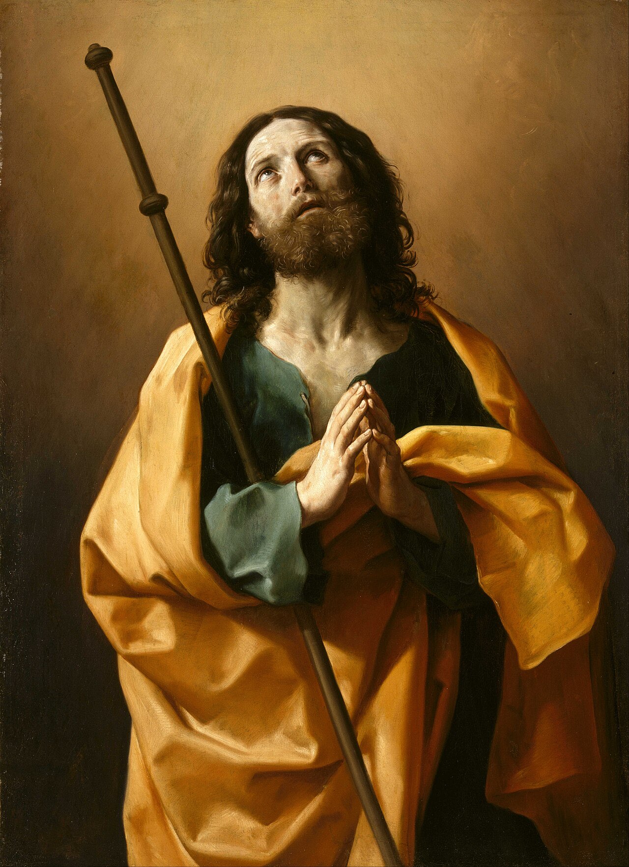 Guido Reni's Saint James the Greater: the apostle in a golden mantle with a pilgrim's staff against his shoulder, hands pressed together, gazing upward.
