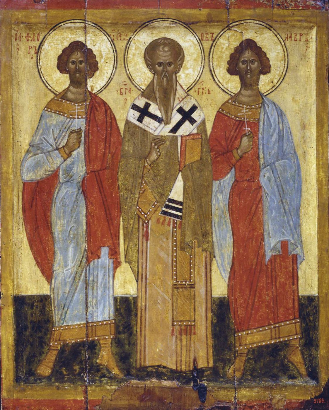 A Russian icon of three saints standing side by side, the bishop James the brother of the Lord in the center holding a Gospel book.