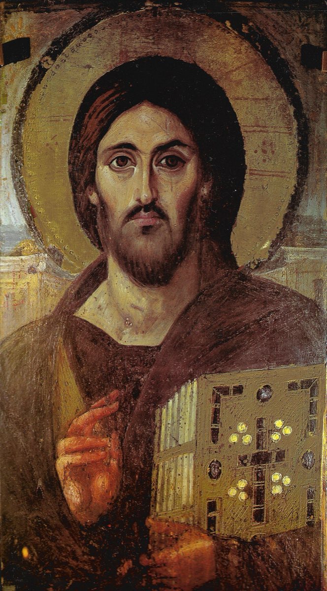 The Christ Pantocrator icon: Jesus with a gold halo, holding a jeweled Gospel book, his right hand raised in blessing, his two eyes famously painted with different expressions.