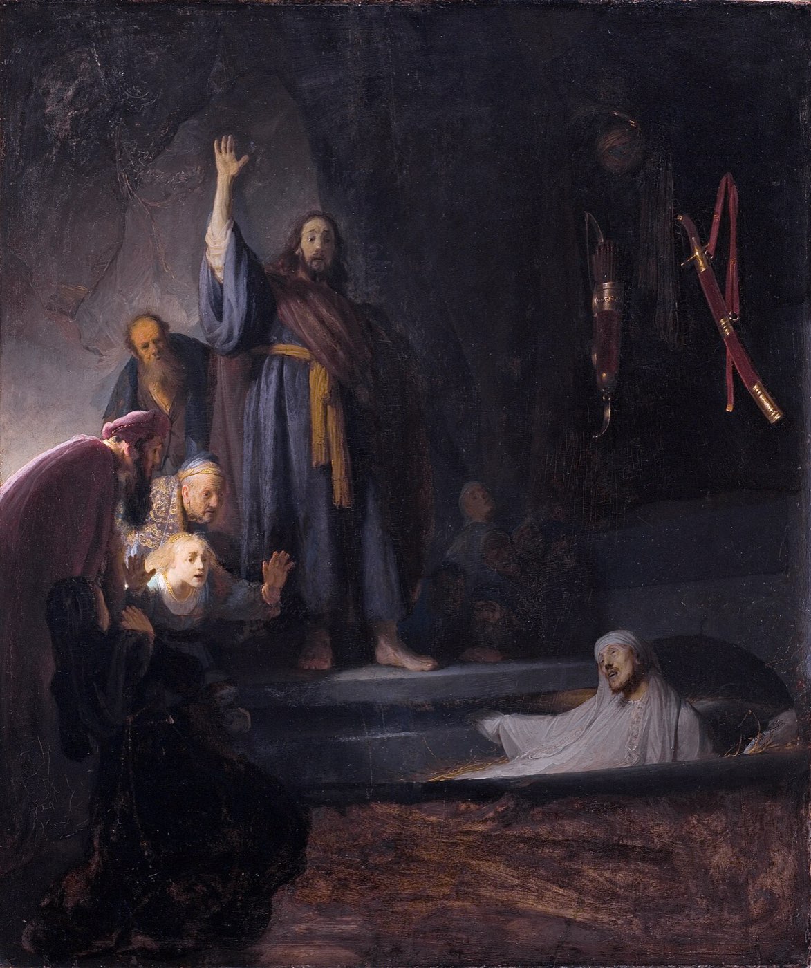 Rembrandt's Raising of Lazarus: Christ stands with a raised hand over the tomb as the shrouded Lazarus rises into the light and witnesses recoil in wonder.
