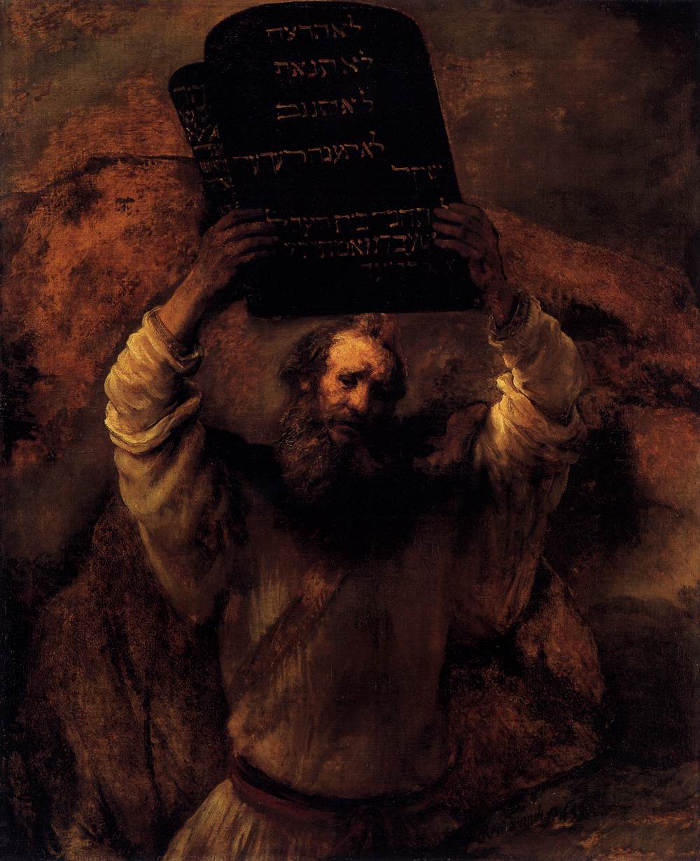 Rembrandt's Moses lifting the tablets of the law above his head, the Hebrew commandments glowing against the dark.
