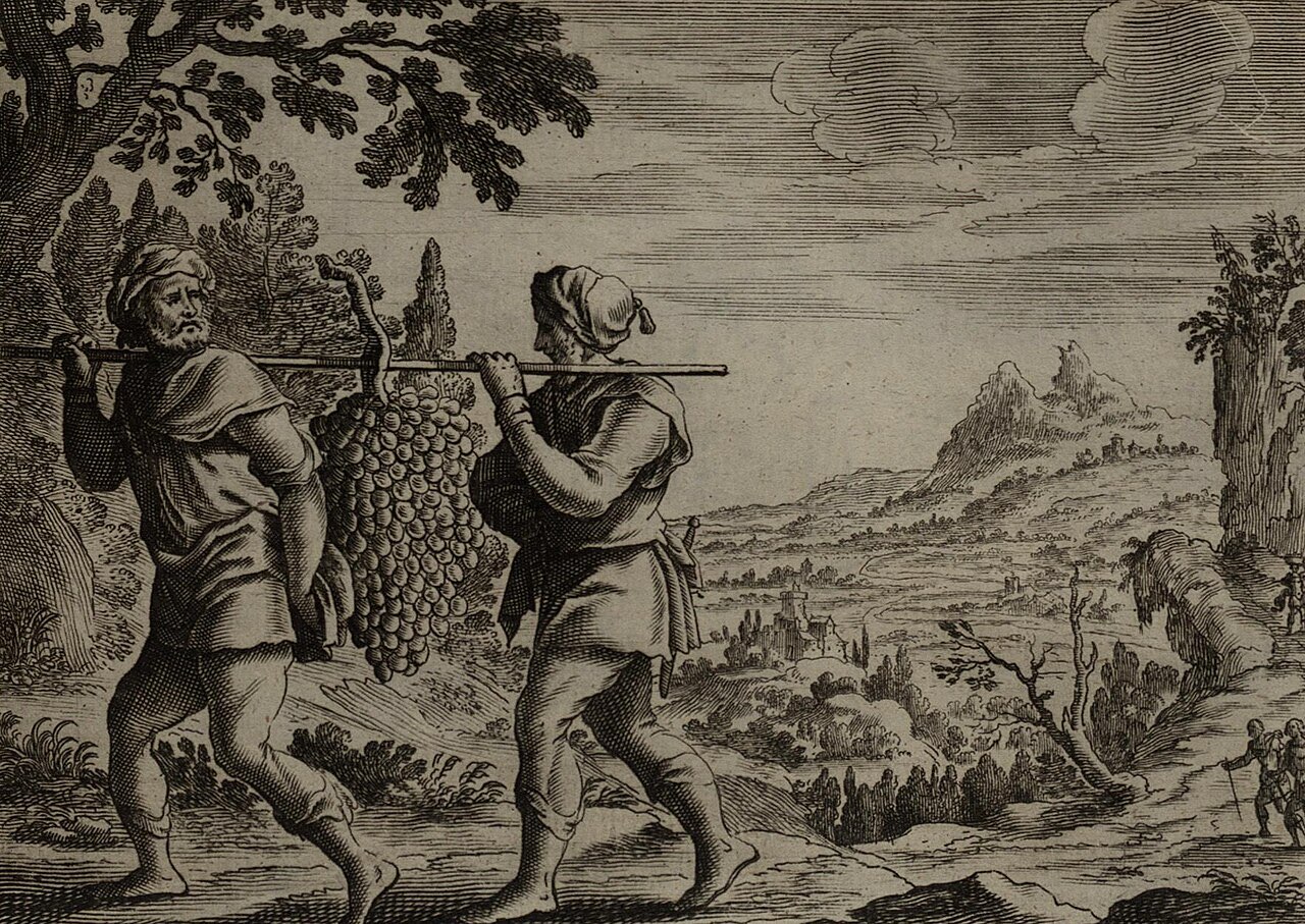 An engraving of the two spies returning from Canaan, carrying between them on a pole a grape cluster so huge it hangs to their knees, with a river valley behind.