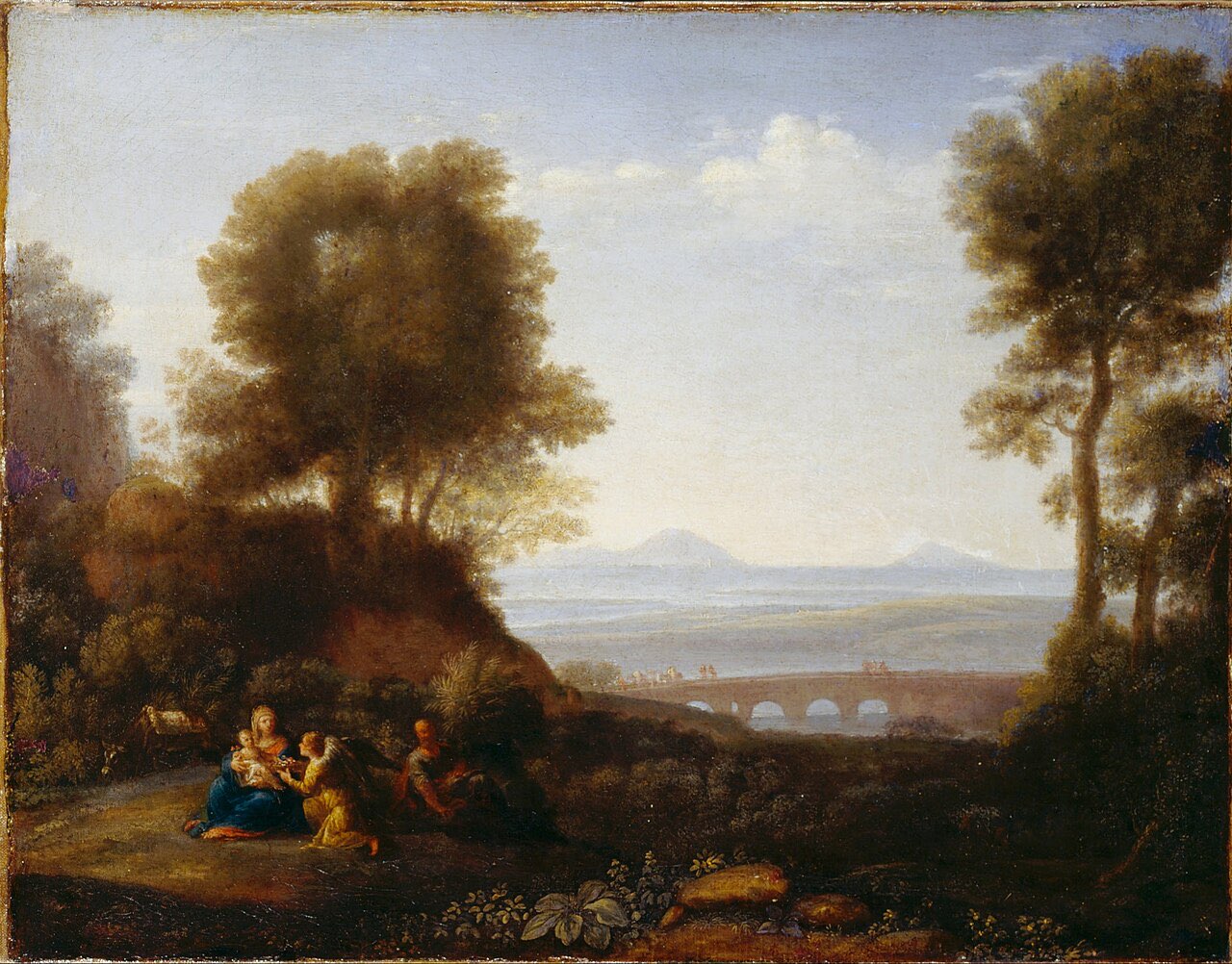 Oil painting: Mary sits with the infant Jesus beneath tall trees while an angel kneels before them and Joseph rests nearby; a river, an arched bridge, and hazy hills stretch into the distance.