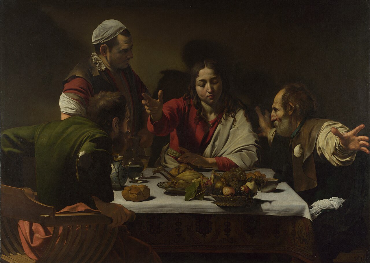 Caravaggio's painting of the supper at Emmaus: at the instant of recognition, one disciple flings his arms wide and another grips his chair, while Jesus blesses the bread at a table set with food.