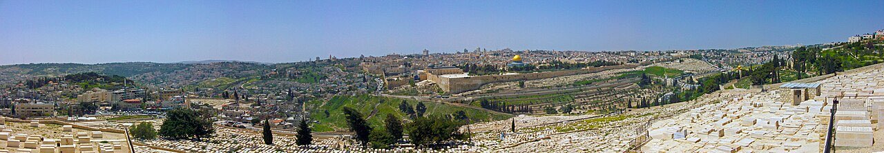 Panorama of Jerusalem's Old City from the Mount of Olives: the golden Dome of the Rock on the temple mount, surrounded by walls, rooftops, and towers.