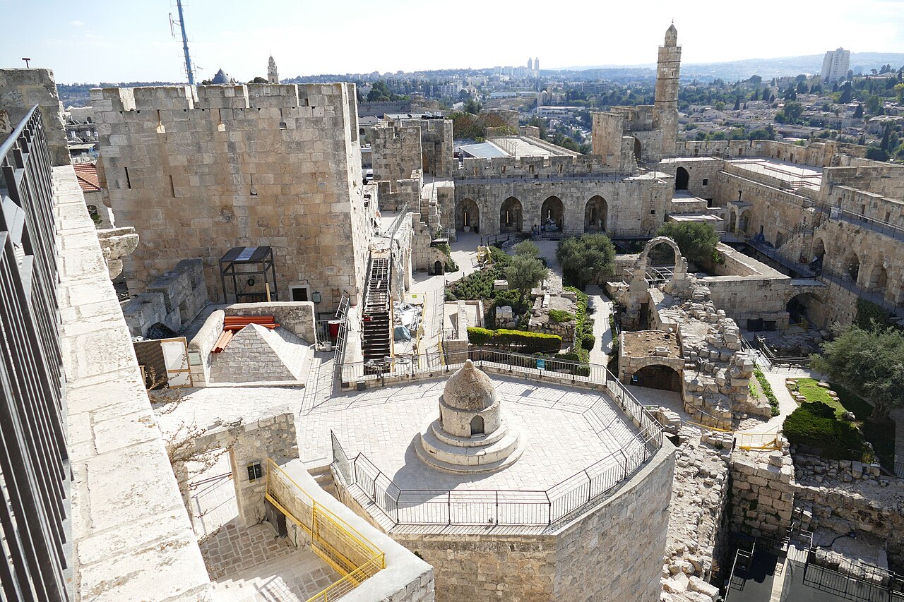 The Tower of David citadel in Jerusalem: massive stone towers and ramparts around an excavated courtyard, built over the site of Herod's palace.