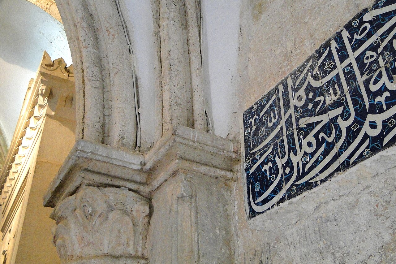 Interior detail of the Cenacle on Mount Zion: a carved column capital and Gothic vaulting in pale stone.